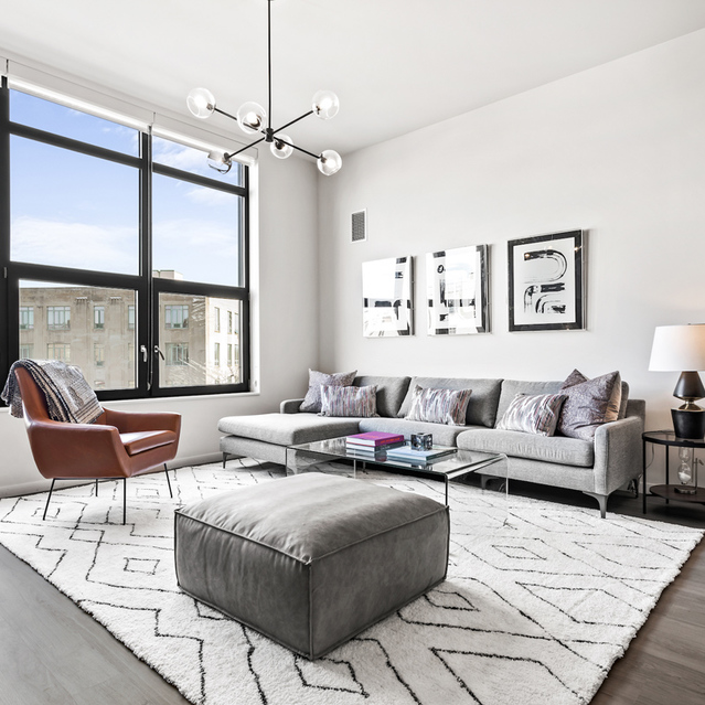 Logan Apartments - Expansive Living Room With Elegant Furnishing