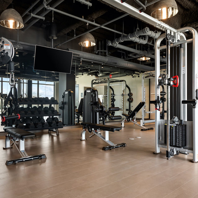 Logan Apartments - Fitness Center with Various Exercise Equipment